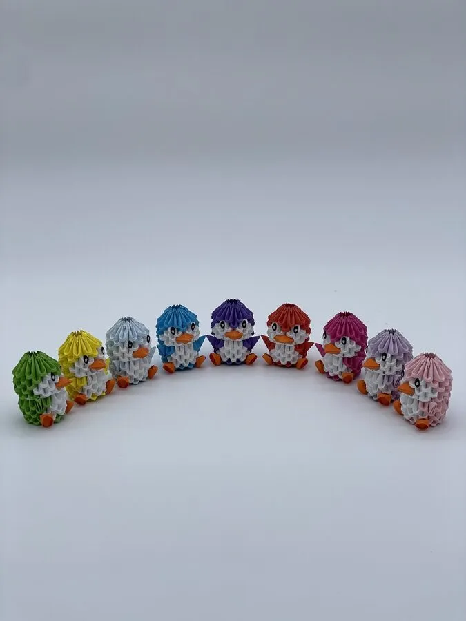 Collection de petits pingouins en origami 3D